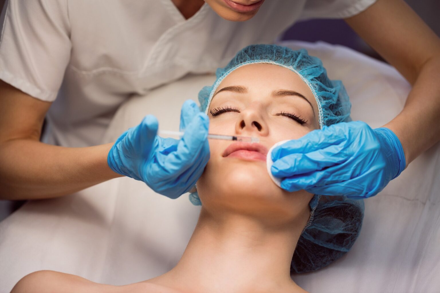 Woman getting injection, in need of infrared sauna cosmetic procedure recovery