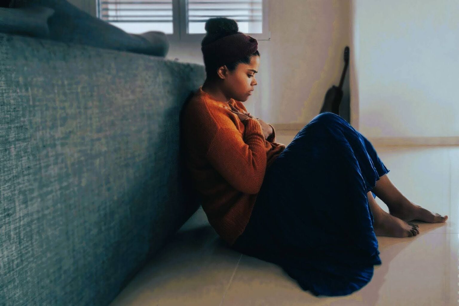 woman suffering from seasonal affective disorder, in need of infrared sauna sessions.