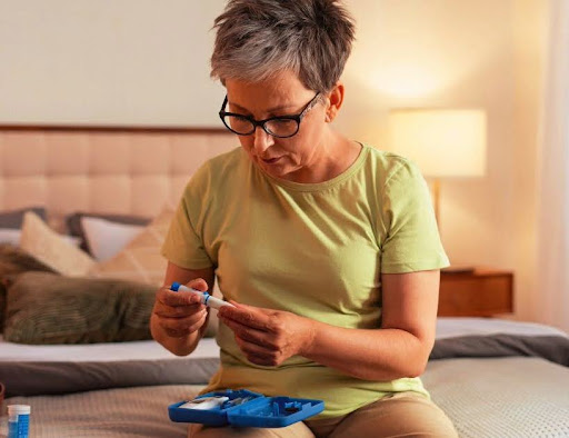 Woman prepares insulin shot for diabetes, considers infrared sauna session.