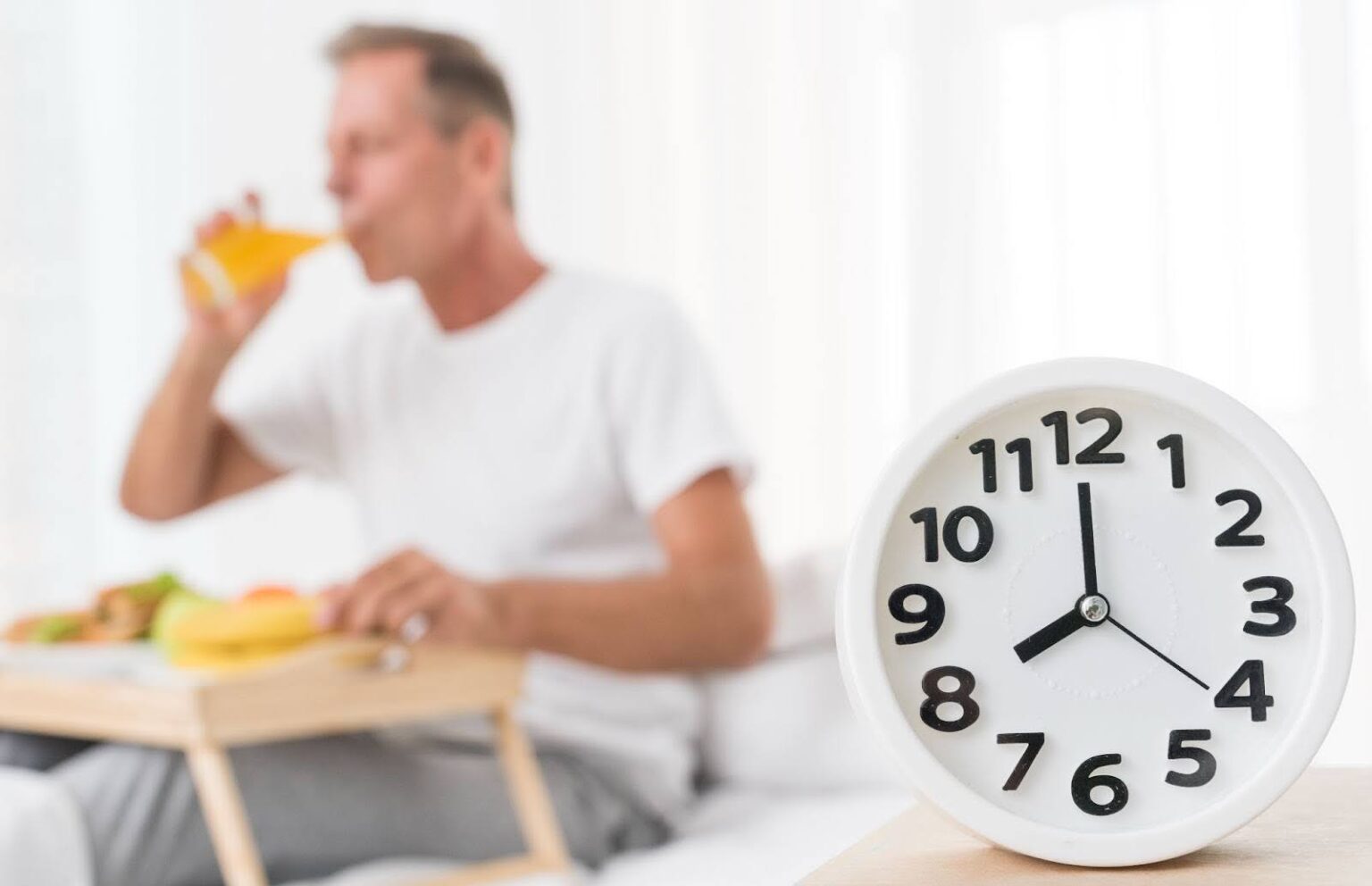 Man finally eating after a fasting period, ready to enjoy an infrared sauna session